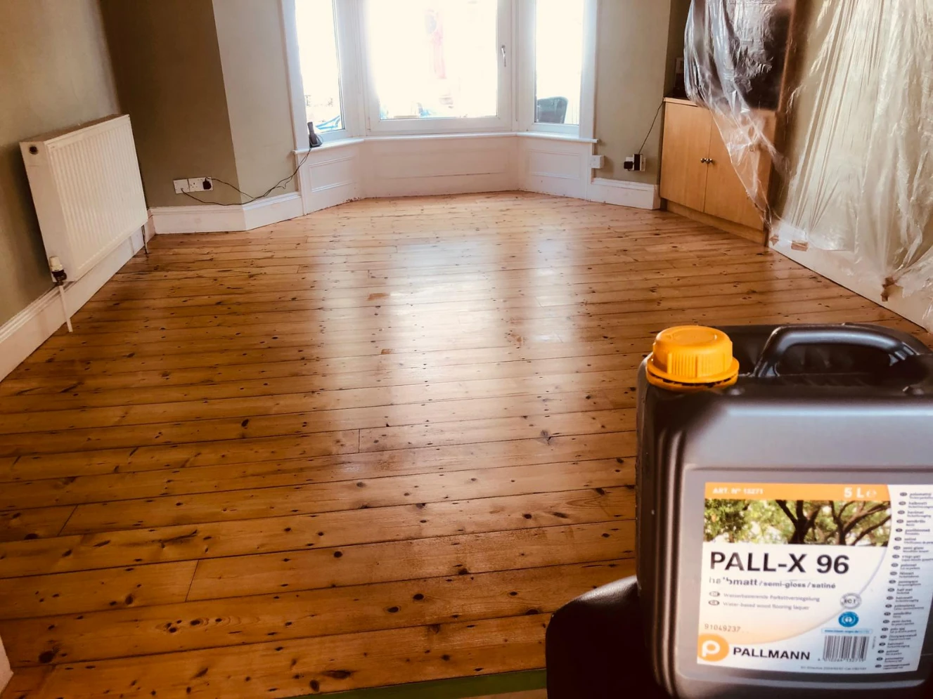 Sanded pine floorboards in a London living room