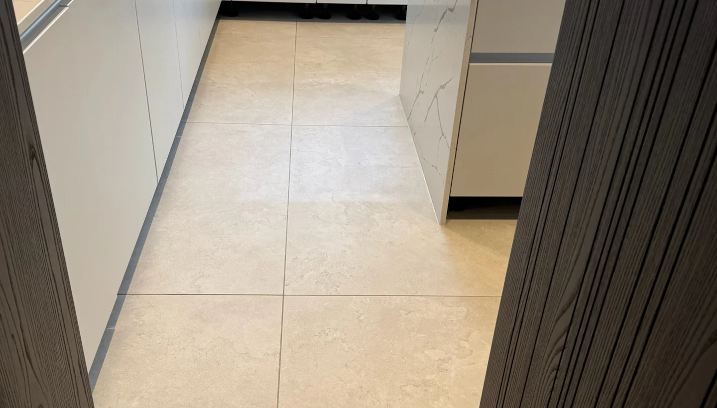 Test patch of PU-sealed porcelain tile floor in Hampstead kitchen