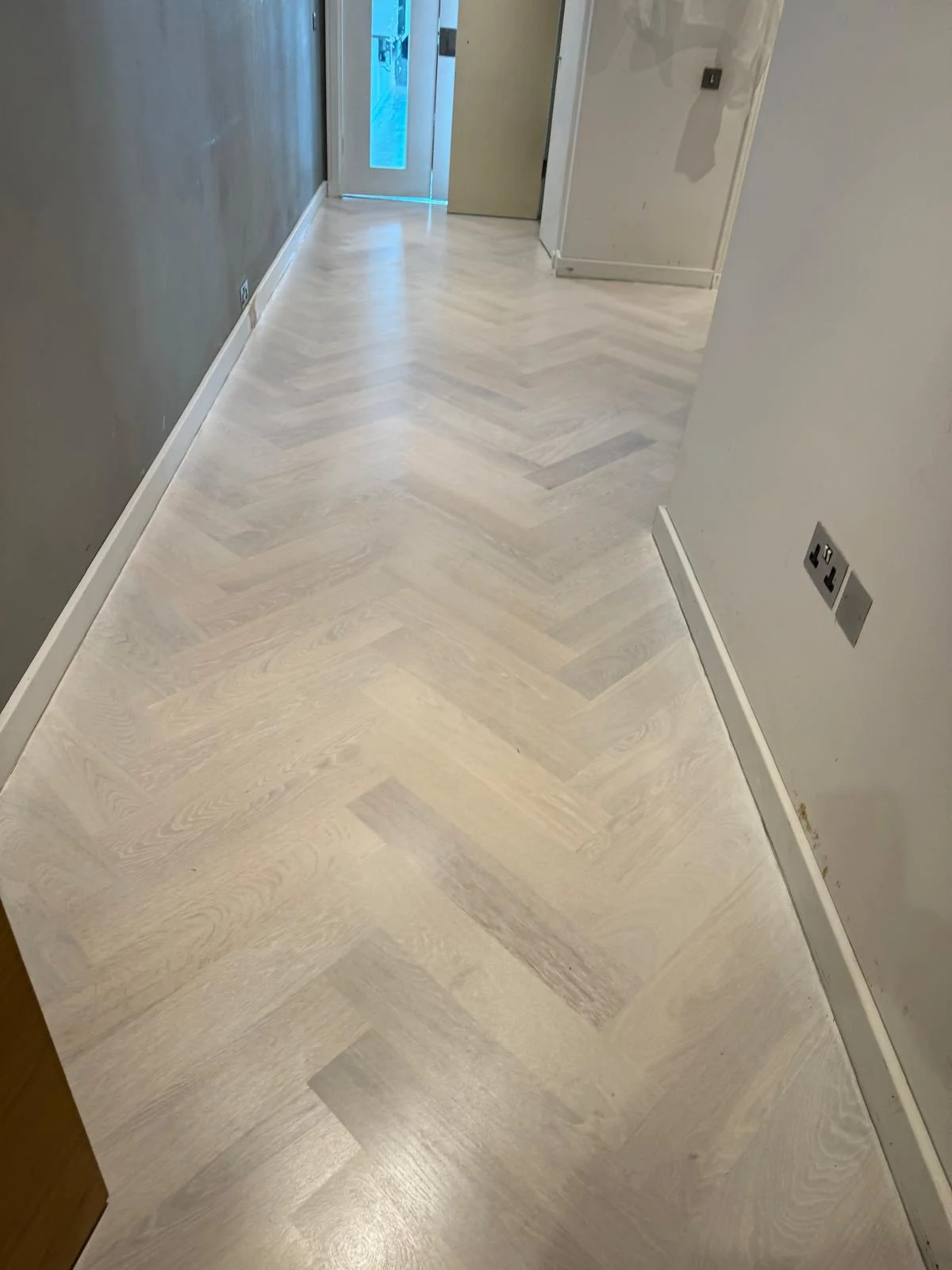 Wood floor sanding and finished with Scandinavian effect white finish in London