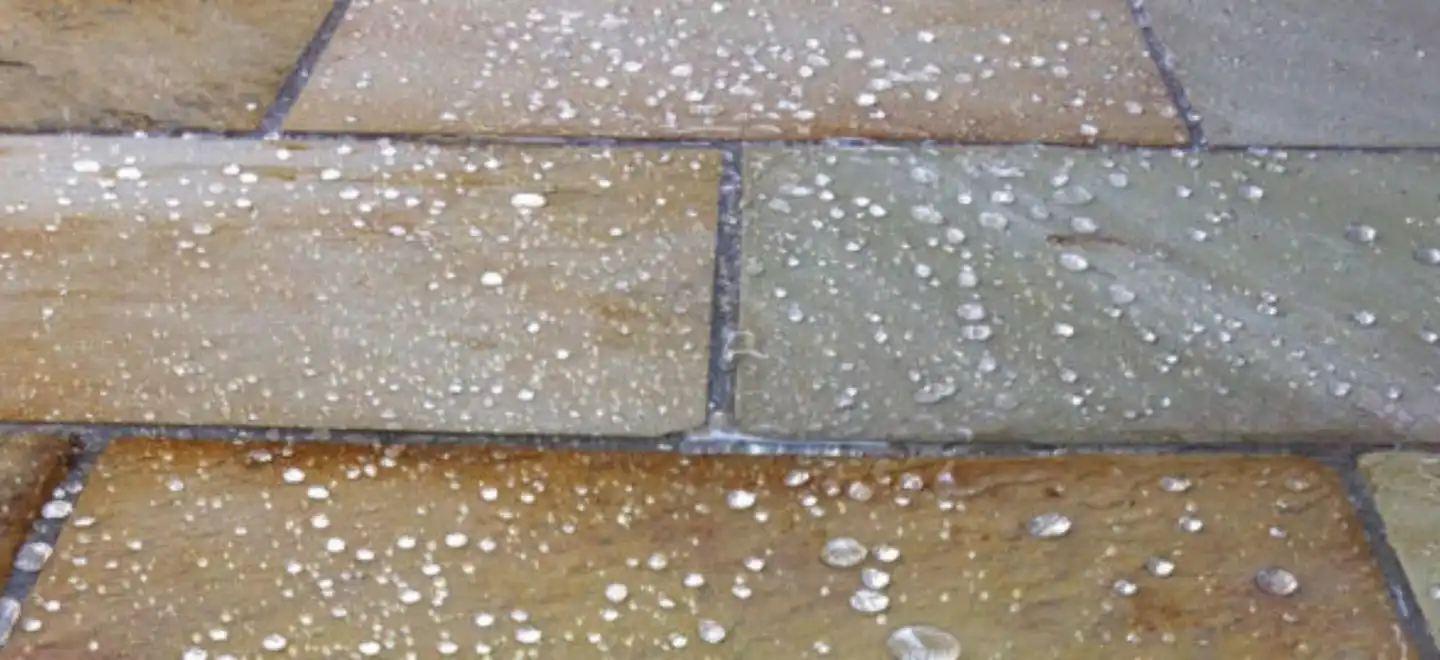 Thumbnail of sealed natural stone floor in London with water droplets showing protection