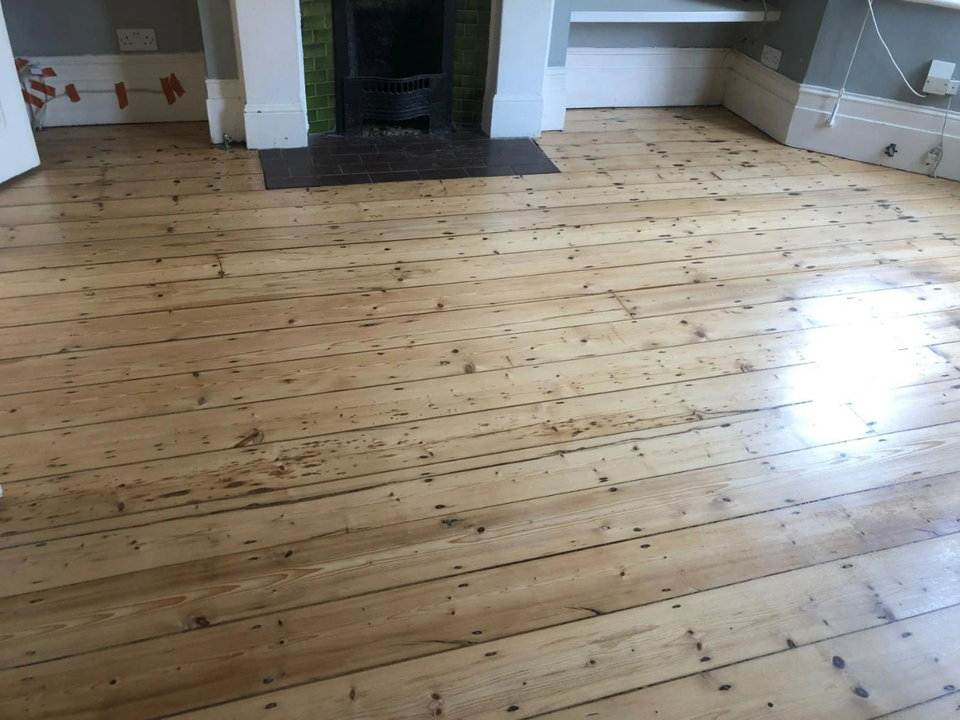 Sanded pine floorboards in a London living room