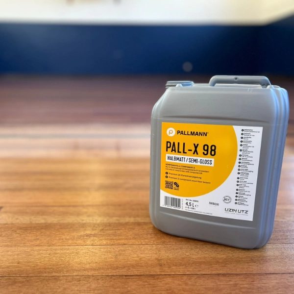 Pallmann Pall-X 98 semi-gloss lacquer placed on a freshly varnished wooden floor, showcasing professional finish options.