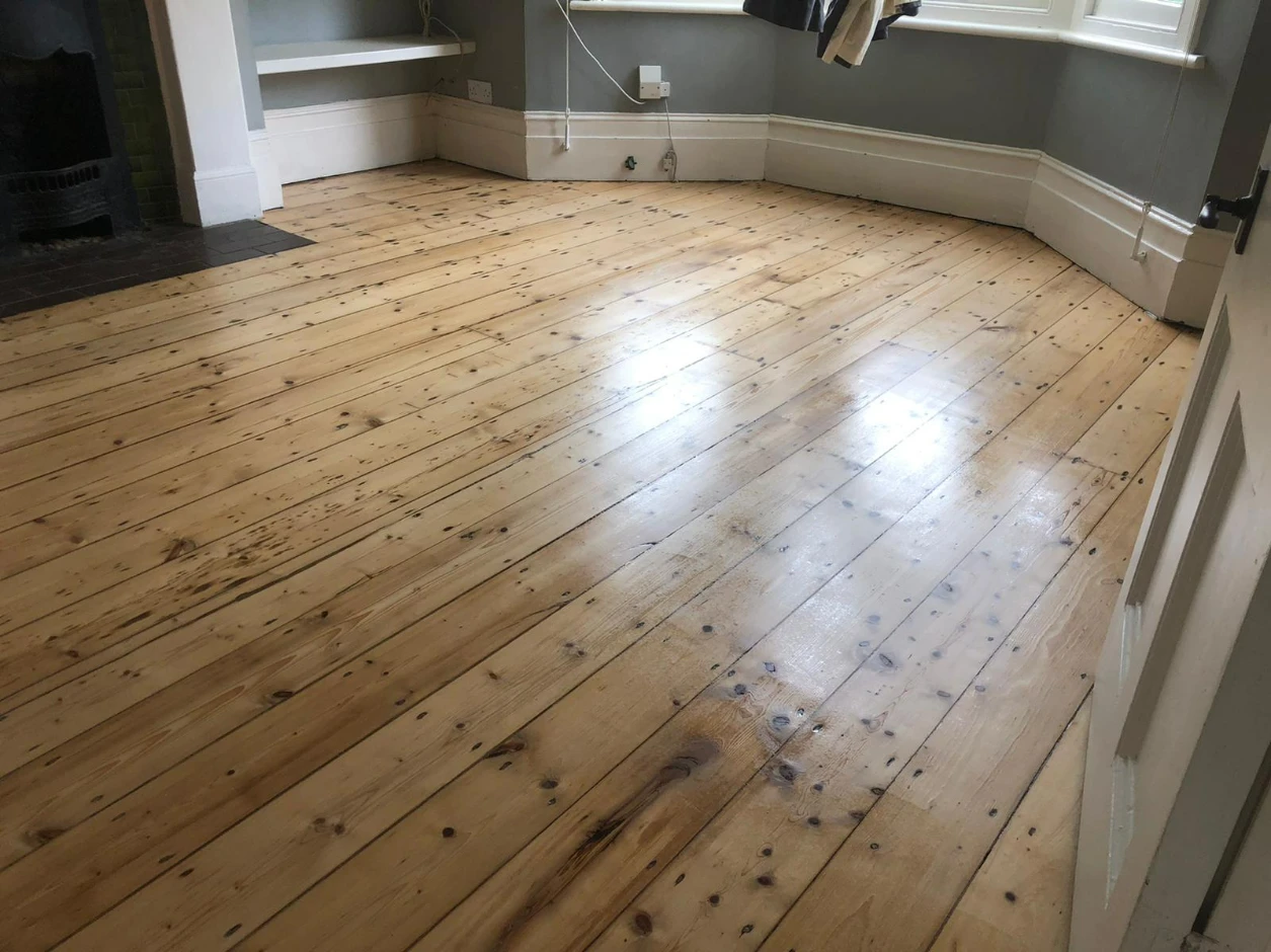 Sanded pine floorboards in a London living room