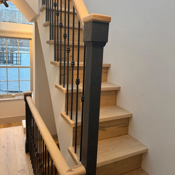 Sanded and refinished oak staircase in Islington showing clean edges and smooth detailing
