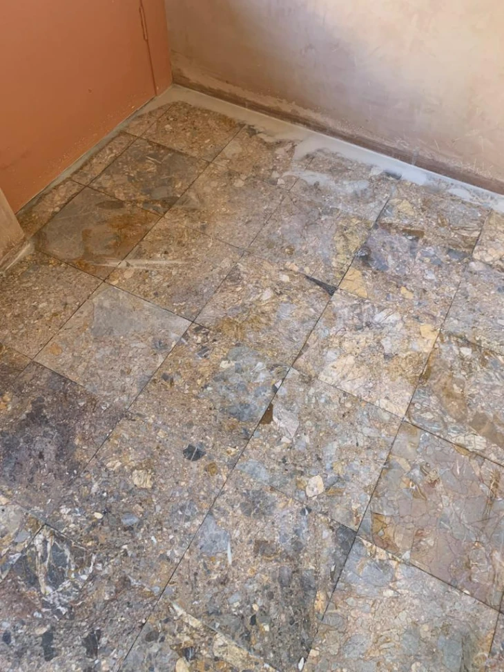 Dull marble floor before cleaning and polishing in London