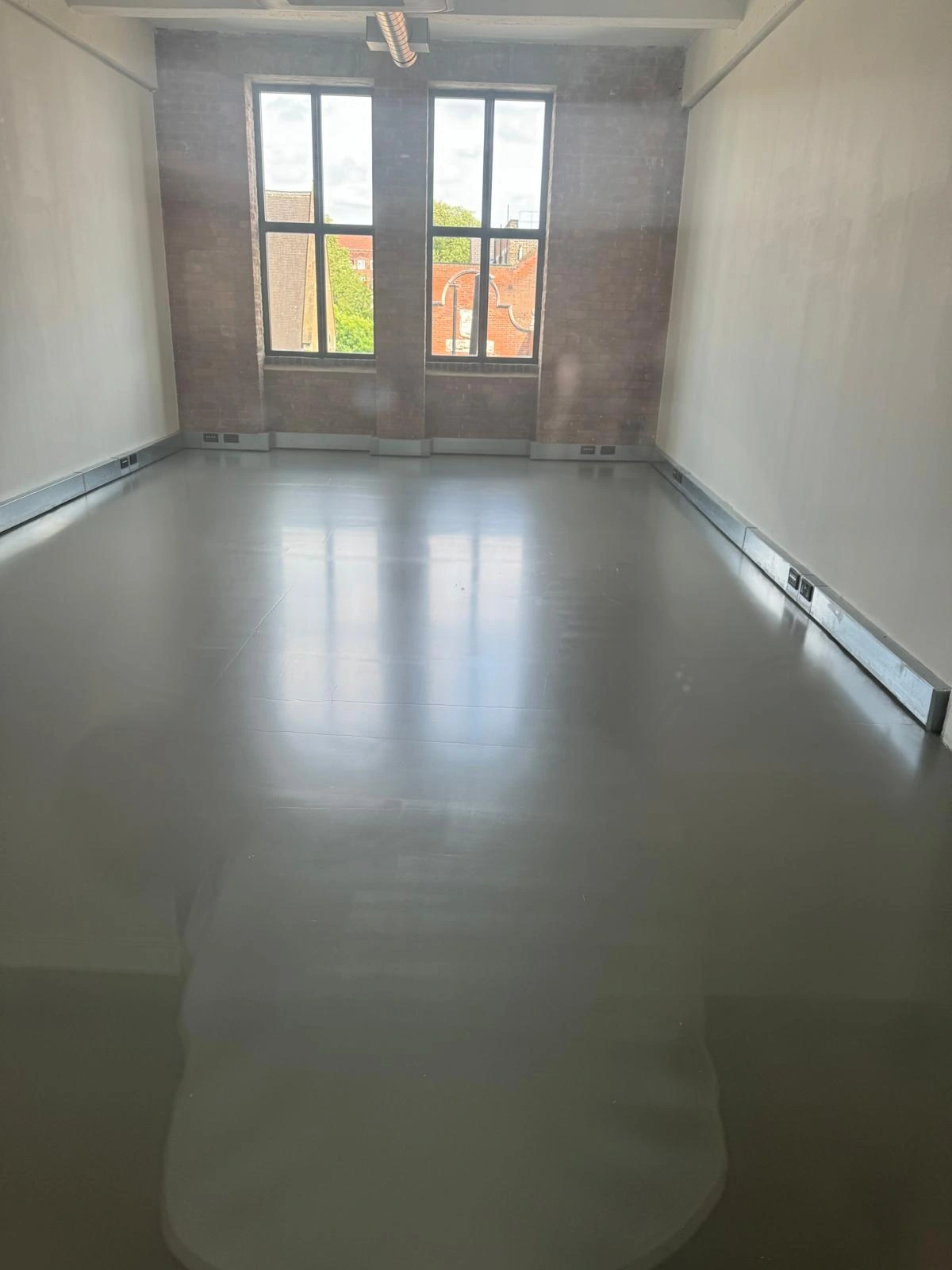 Restored resin floor in a Hackney studio space after deep cleaning and two coats of Dr. Schutz PU sealer.