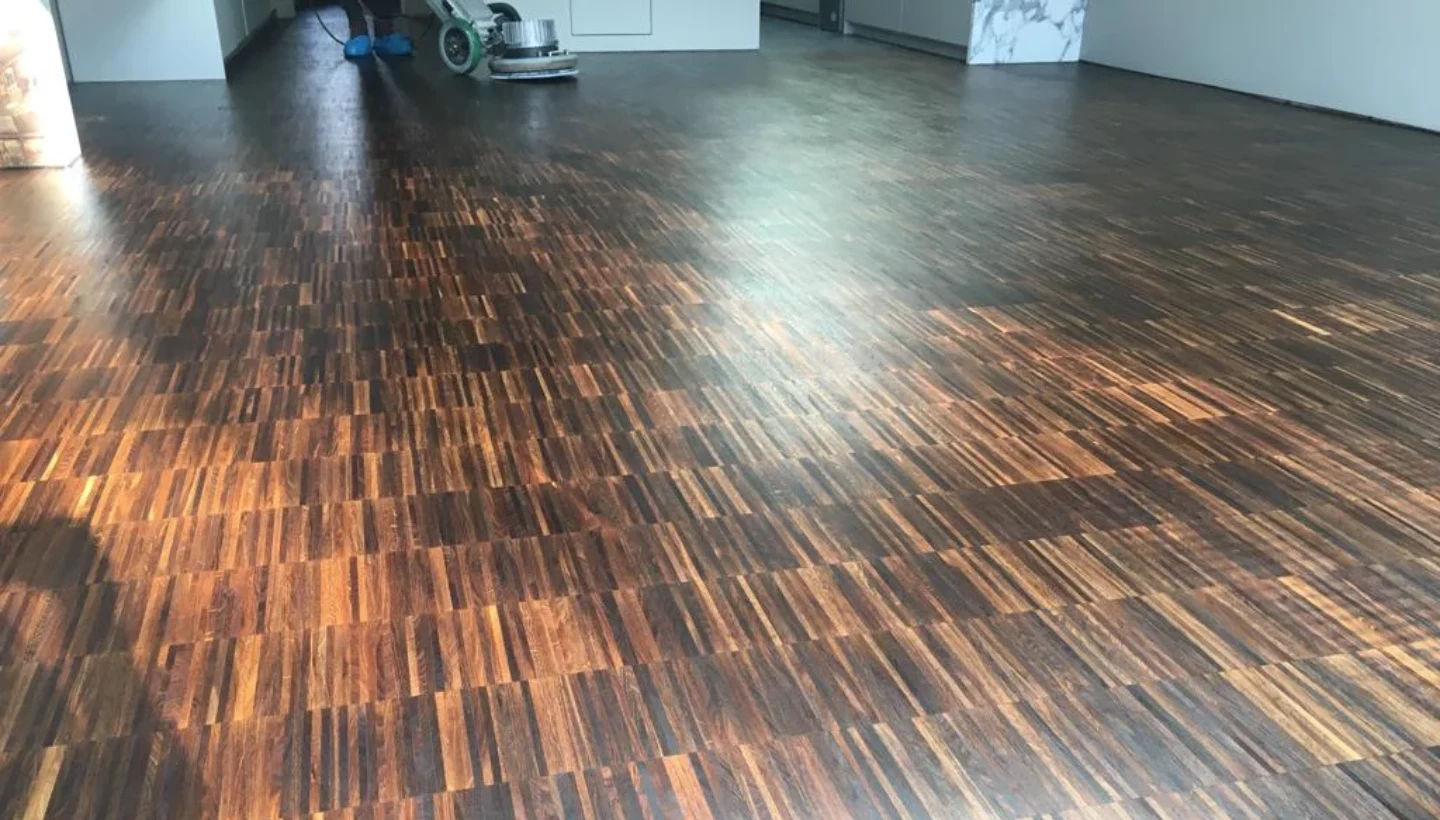 A fully restored fumed oak floor in Wandsworth, London, showcasing a smooth, rich finish after expert sanding and oiling with Pallmann Magic Oil 2K, completed with minimal disruption.