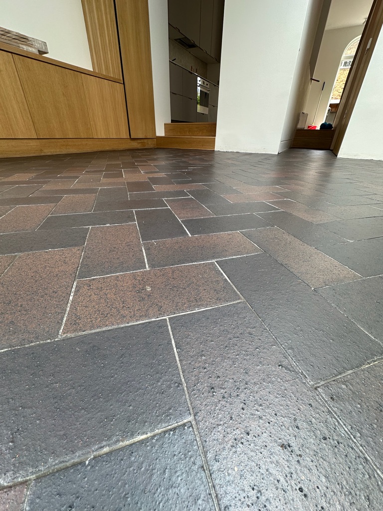 Close-up of a sealed blue brick ceramic floor in Kentish Town.