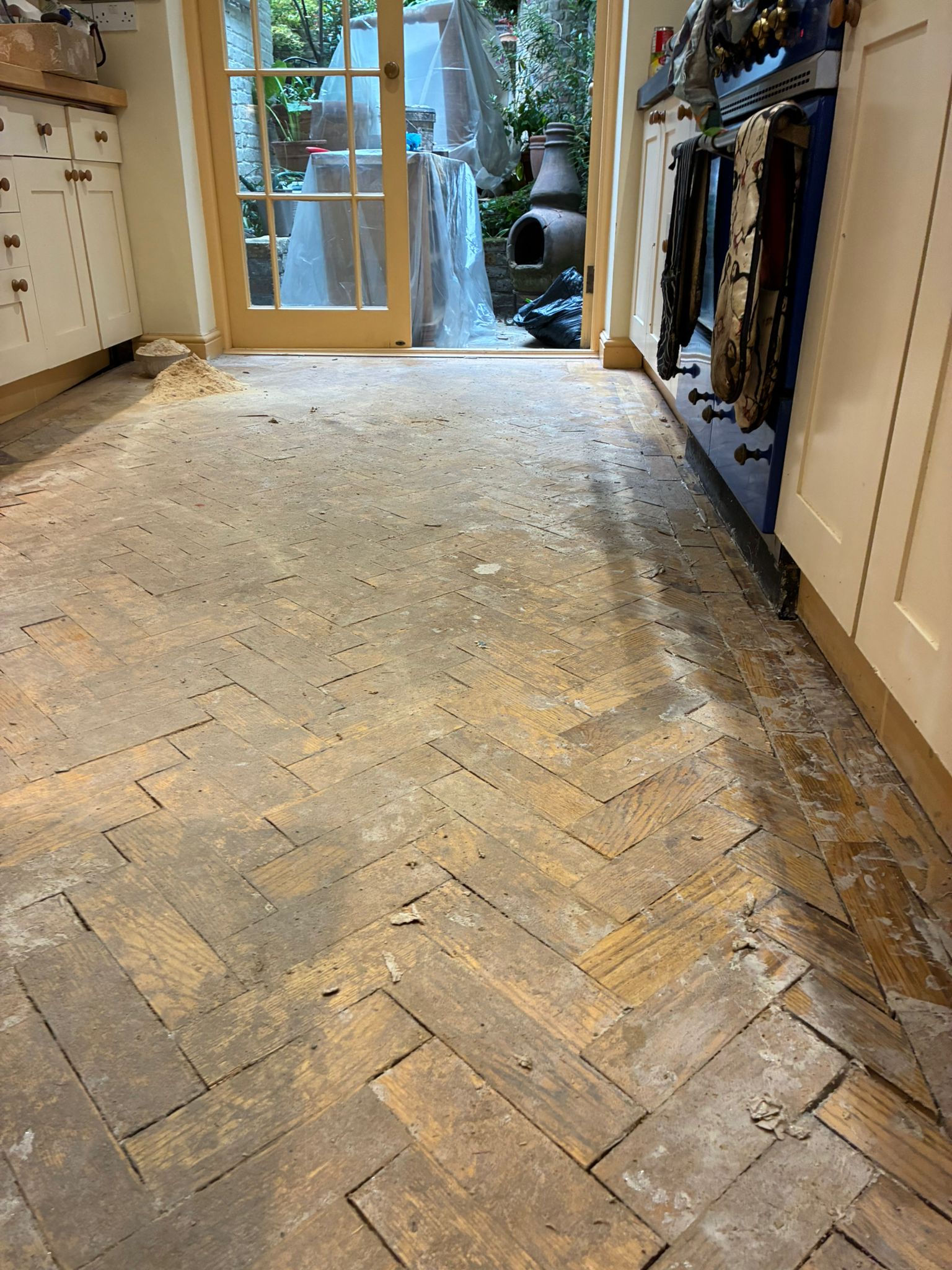 Original oak parquet flooring before restoration work in Angel, London