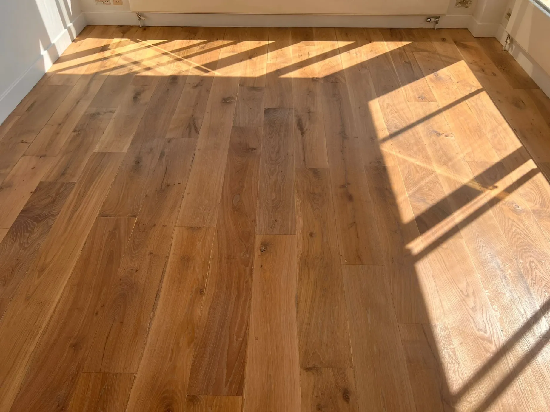 Finished wooden floor in Soho with Pallmann Magic Oil Pure, showcasing a rich and natural bare wood effect.