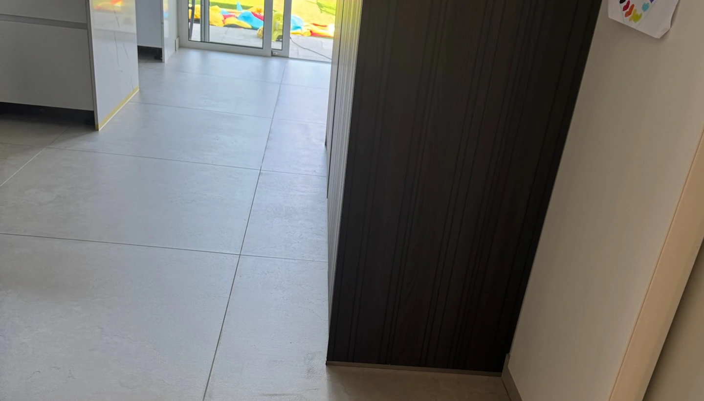 Bright porcelain kitchen floor after PU sealing treatment in Hampstead