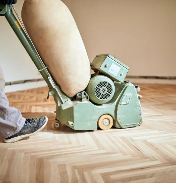Professional wood floor sanding and restoration service in London, using advanced equipment for dust-free results.