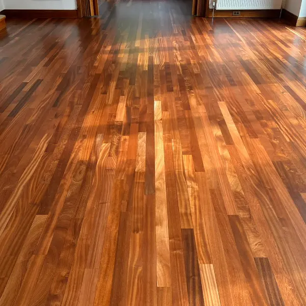 Bright and polished wooden floor in a Kensington property, showing a flawless professional finish that reflects high-quality workmanship