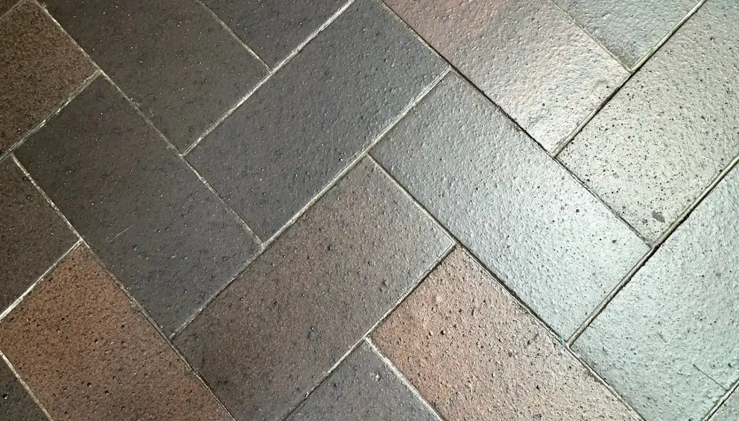 Detailed surface view of blue brick ceramic tiles showing texture and grout lines