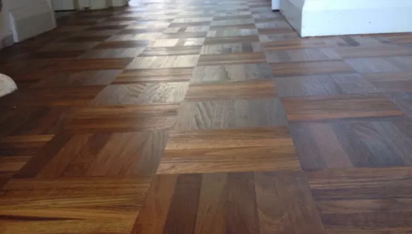 Restored 5-finger parquet teak floor finished with Magic Oil from Pallmann, showcasing its rich grain and vibrant natural tones in a London home.