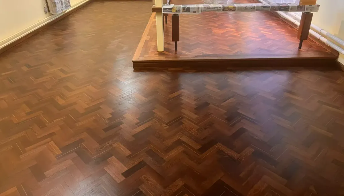 Beautifully restored Wenge wood floor with herringbone pattern in Heston church interior