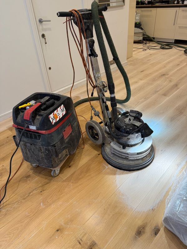 Oak floor sanding and finishing machine in use in London
