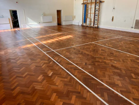 Floor repairs and sanding caterham in a school