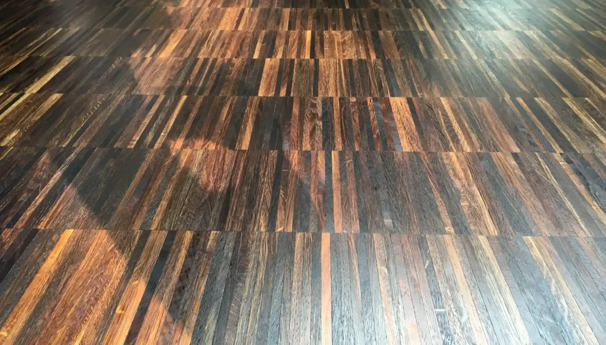 A beautifully restored fumed oak floor in Wandsworth, London, showcasing its deep grain patterns and enhanced colour variation after expert sanding and oiling with Pallmann Magic Oil 2K.
