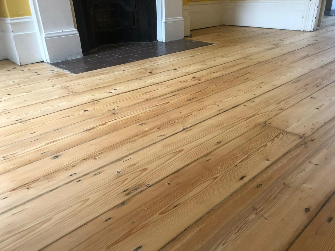 Sanded pine floorboards in a London living room