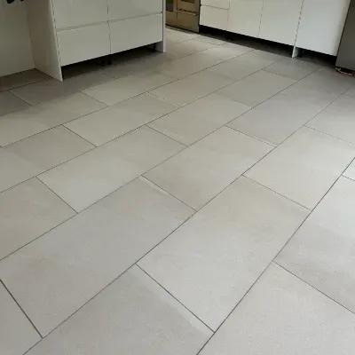 Clean textured porcelain tile floor in a modern London kitchen after professional maintenance