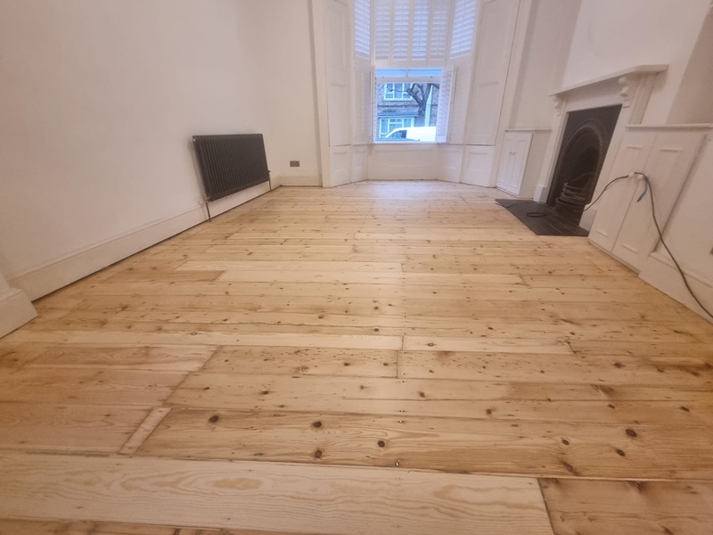 Victorian pine floorboards in London home during preparation stage before sanding and restoration