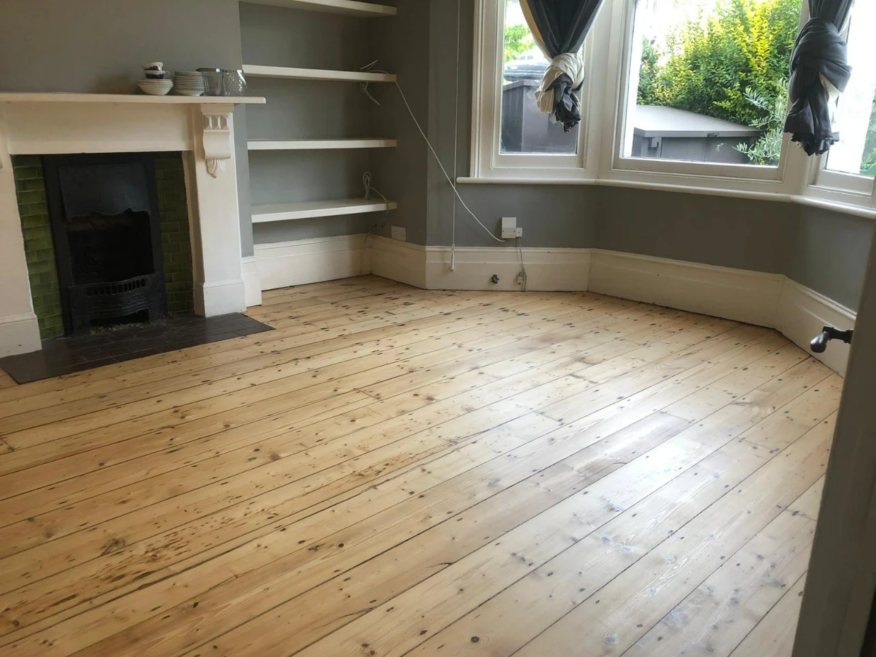 Sanded pine floorboards in a London living room