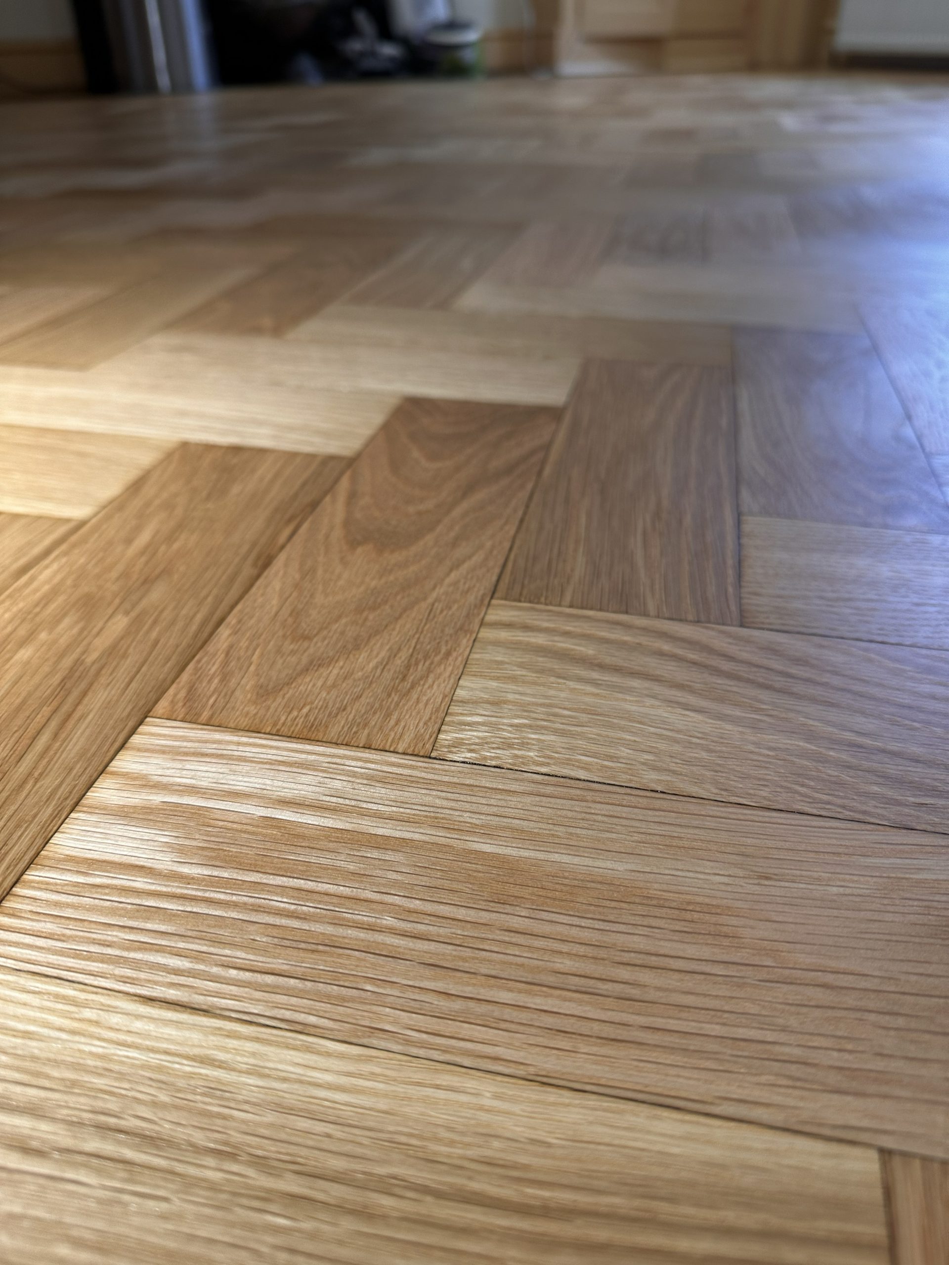 Close-up of restored oak parquet flooring showing grain detail in Angel, London