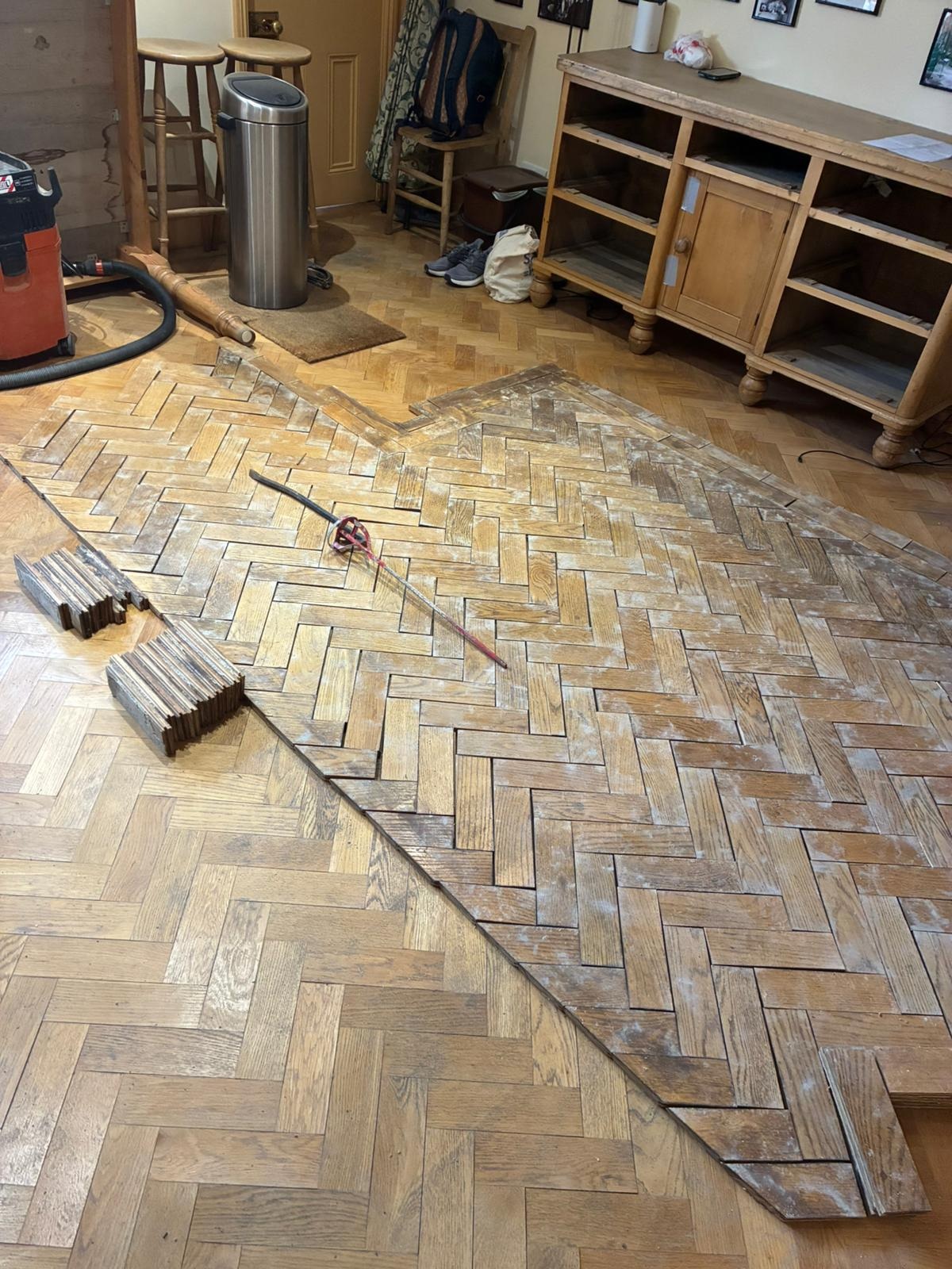 Oak parquet floor repair in progress during restoration in Angel, London