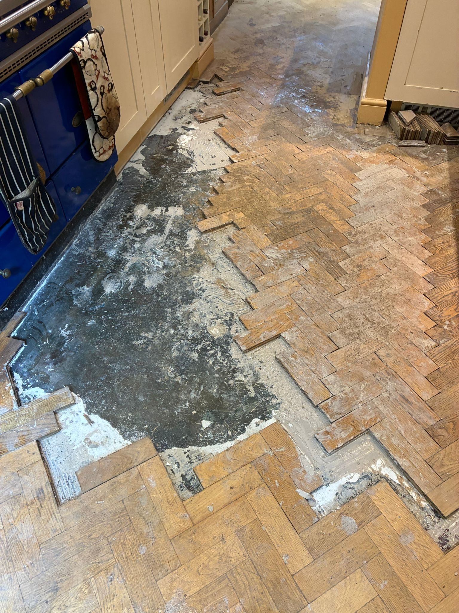 Section of damaged oak parquet floor opened up for repair in Angel, London