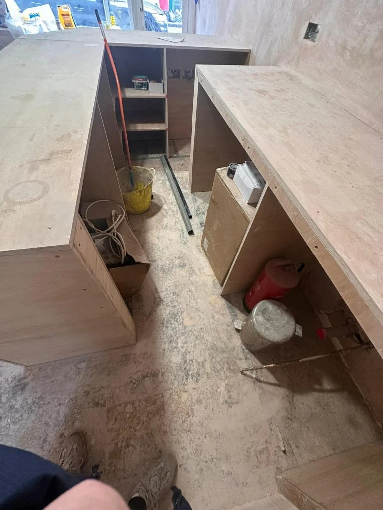 Marble floor around shop counter before cleaning in London