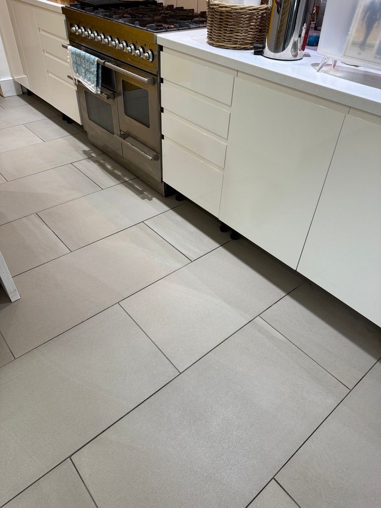 London kitchen ceramic tile floor cleaning result beside fitted cabinets and range cooker