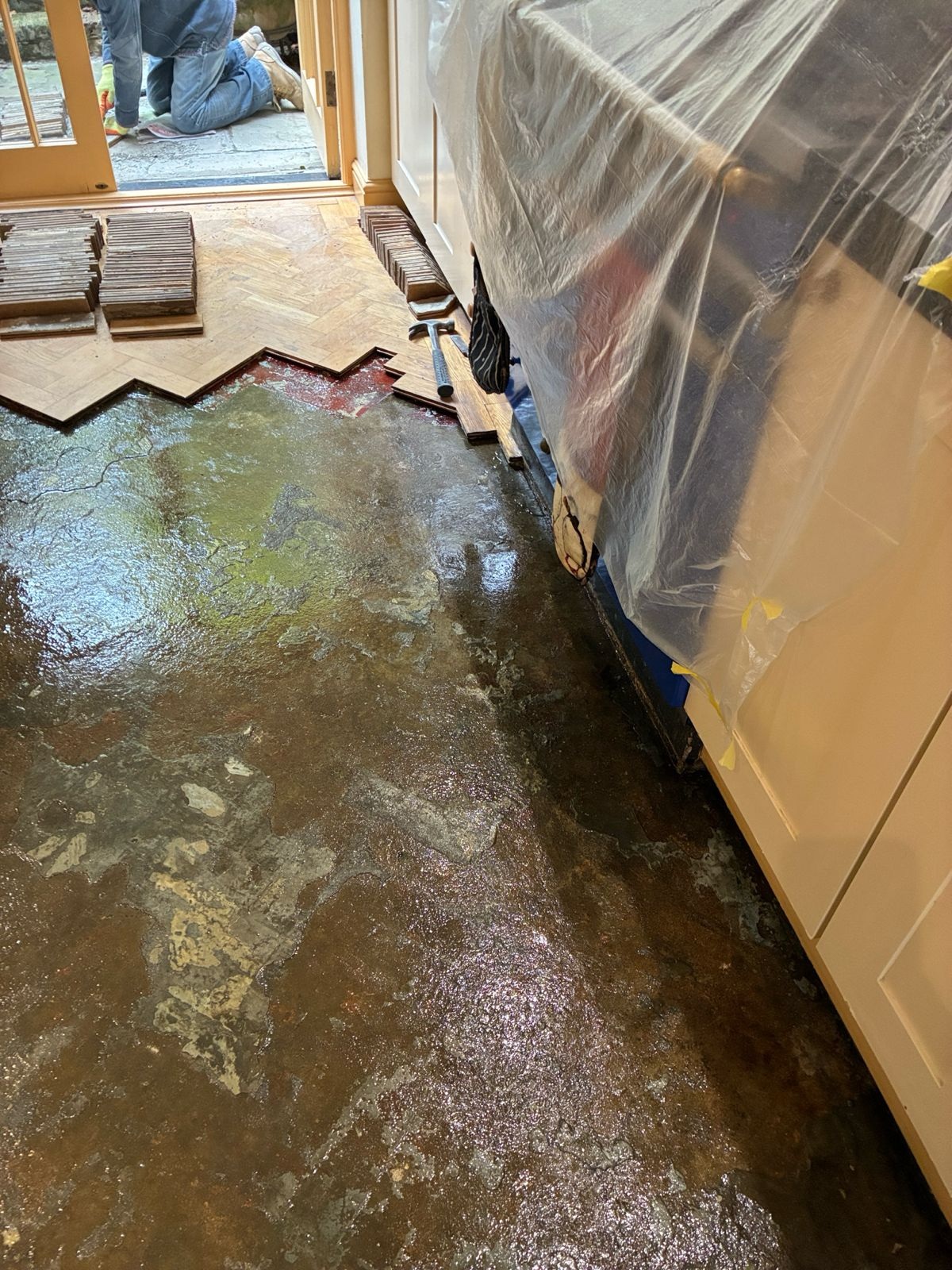 Subfloor exposed during parquet floor restoration in Angel, London