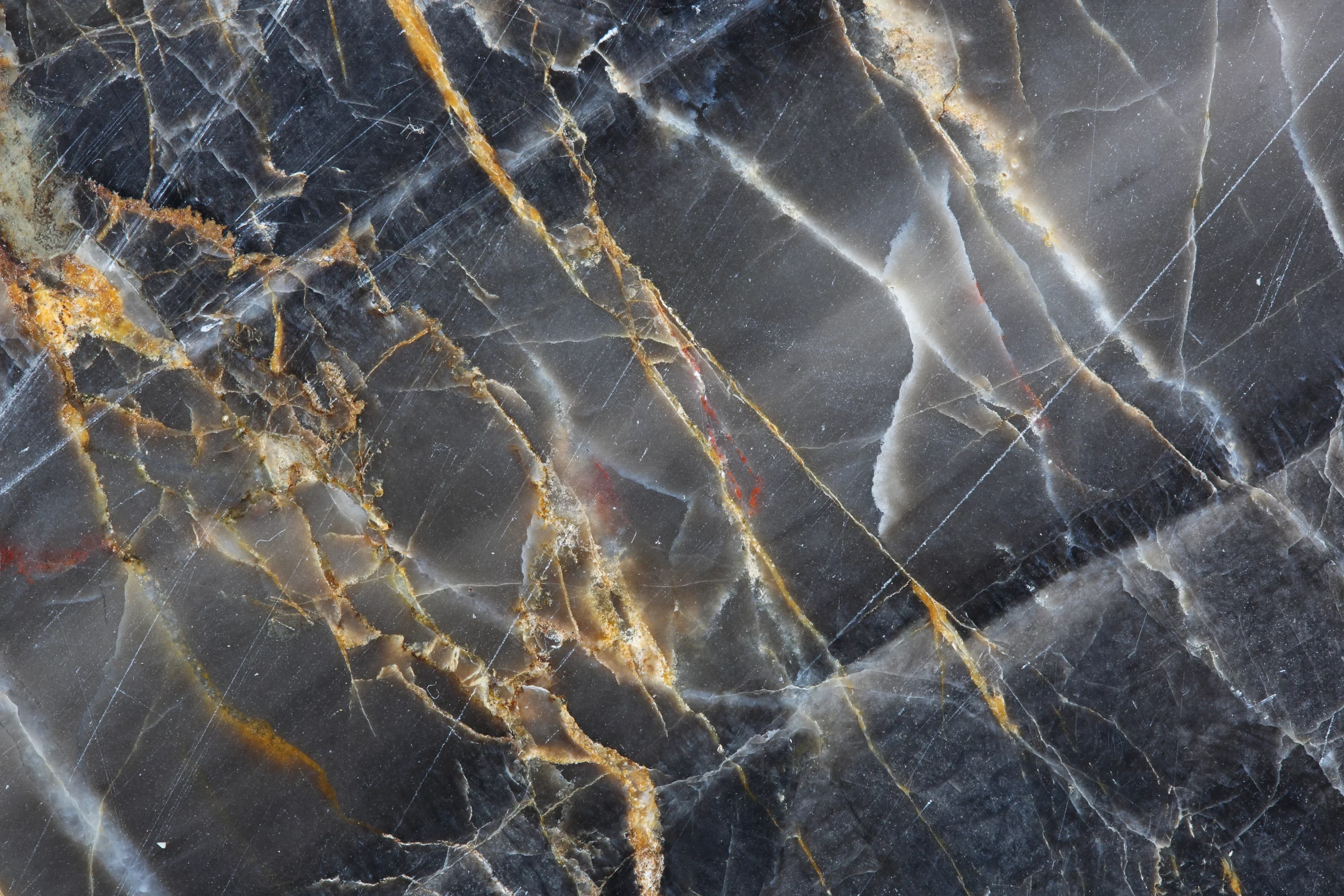 Close-up of a marble surface before professional cleaning and polishing in London.