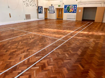 Floor repairs and sanding caterham in a school