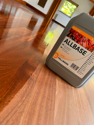 Pallmann Allbase primer applied on a teak floor in Whetstone, highlighting the preparation stage for a durable and flawless finish.