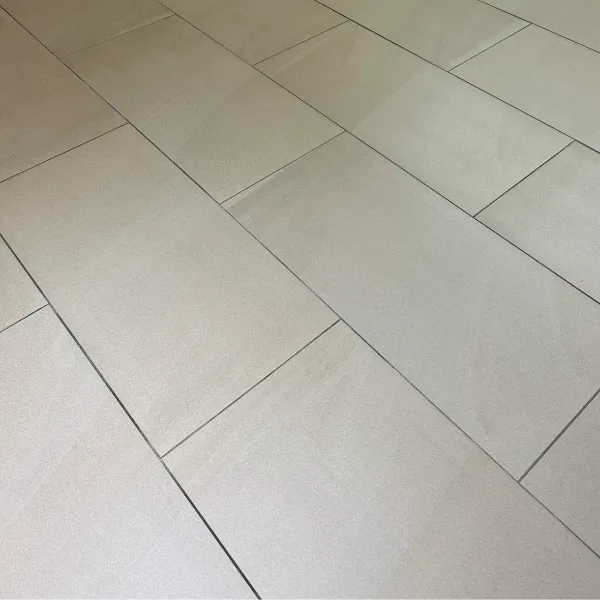 Close-up of cleaned unglazed porcelain tiles in a commercial setting