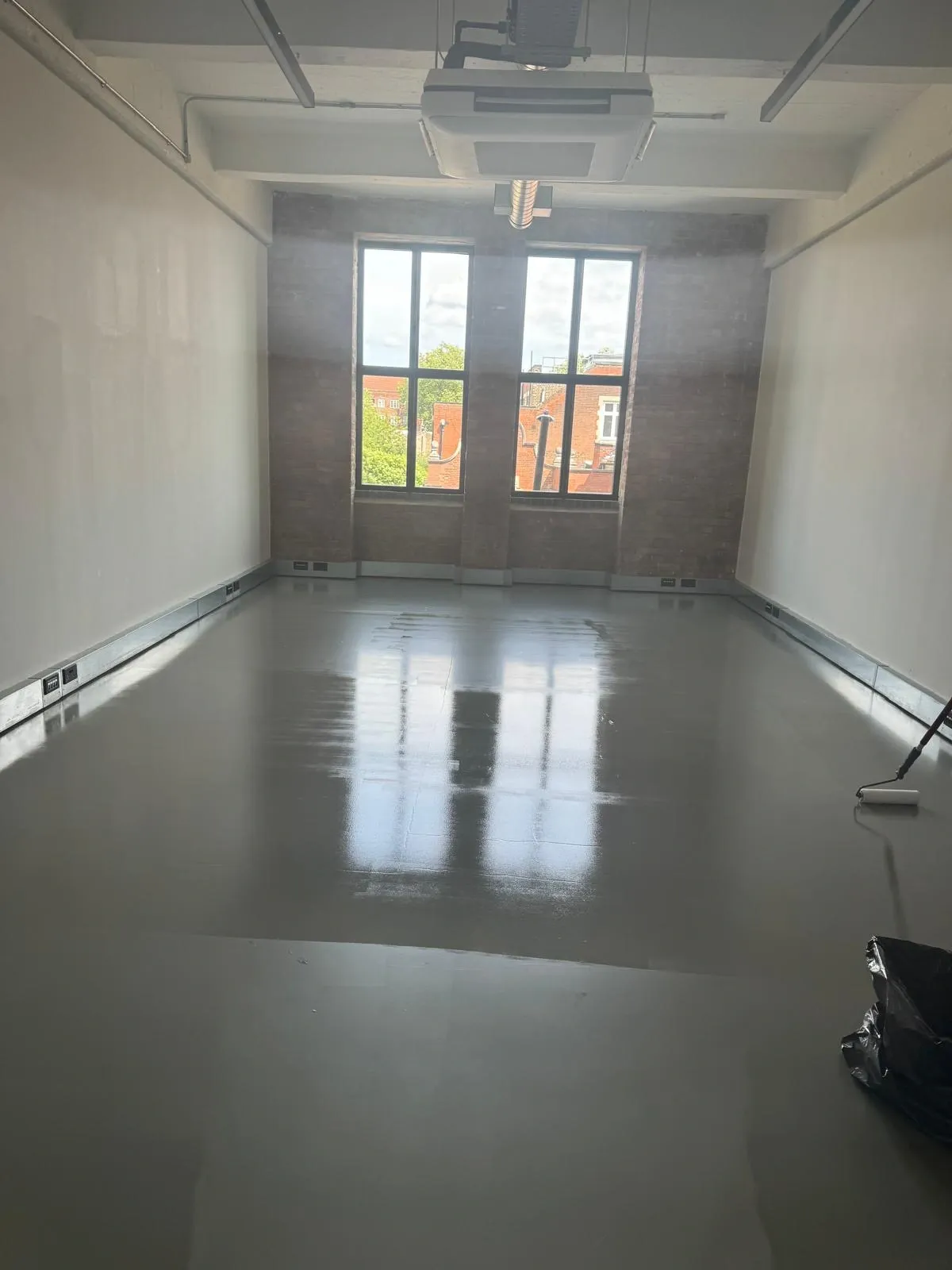 Resin floor after deep cleaning and sealing in a studio space in Hackney, London.