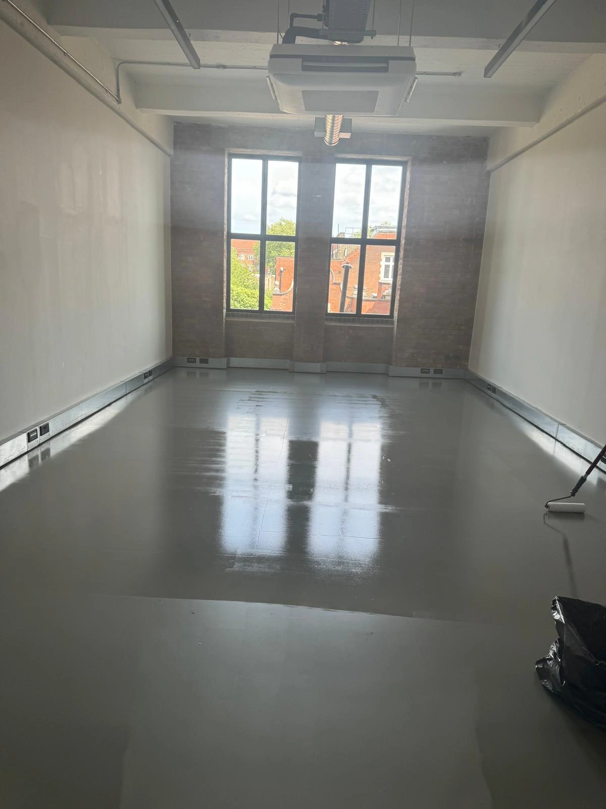 Resin floor after deep cleaning and sealing in a studio space in Hackney, London.