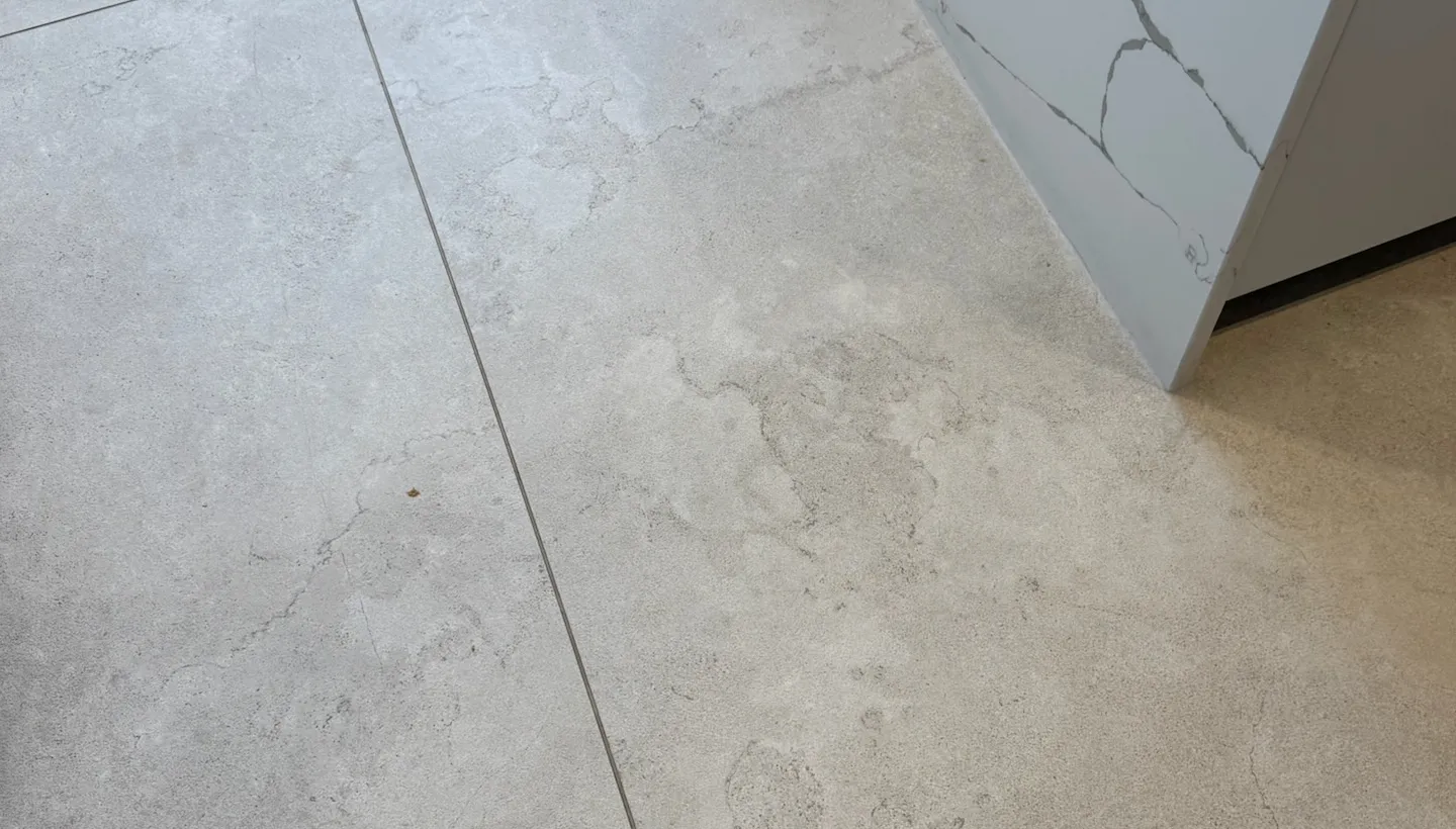 Close-up of textured porcelain tile surface showing embedded dirt in Hampstead kitchen
