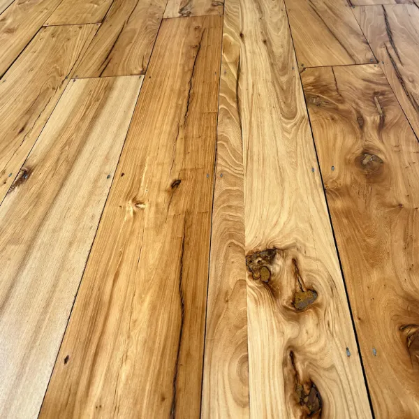 Close-up of beautifully restored wooden floorboards in Islington showing a smooth, sealed, and protected finish