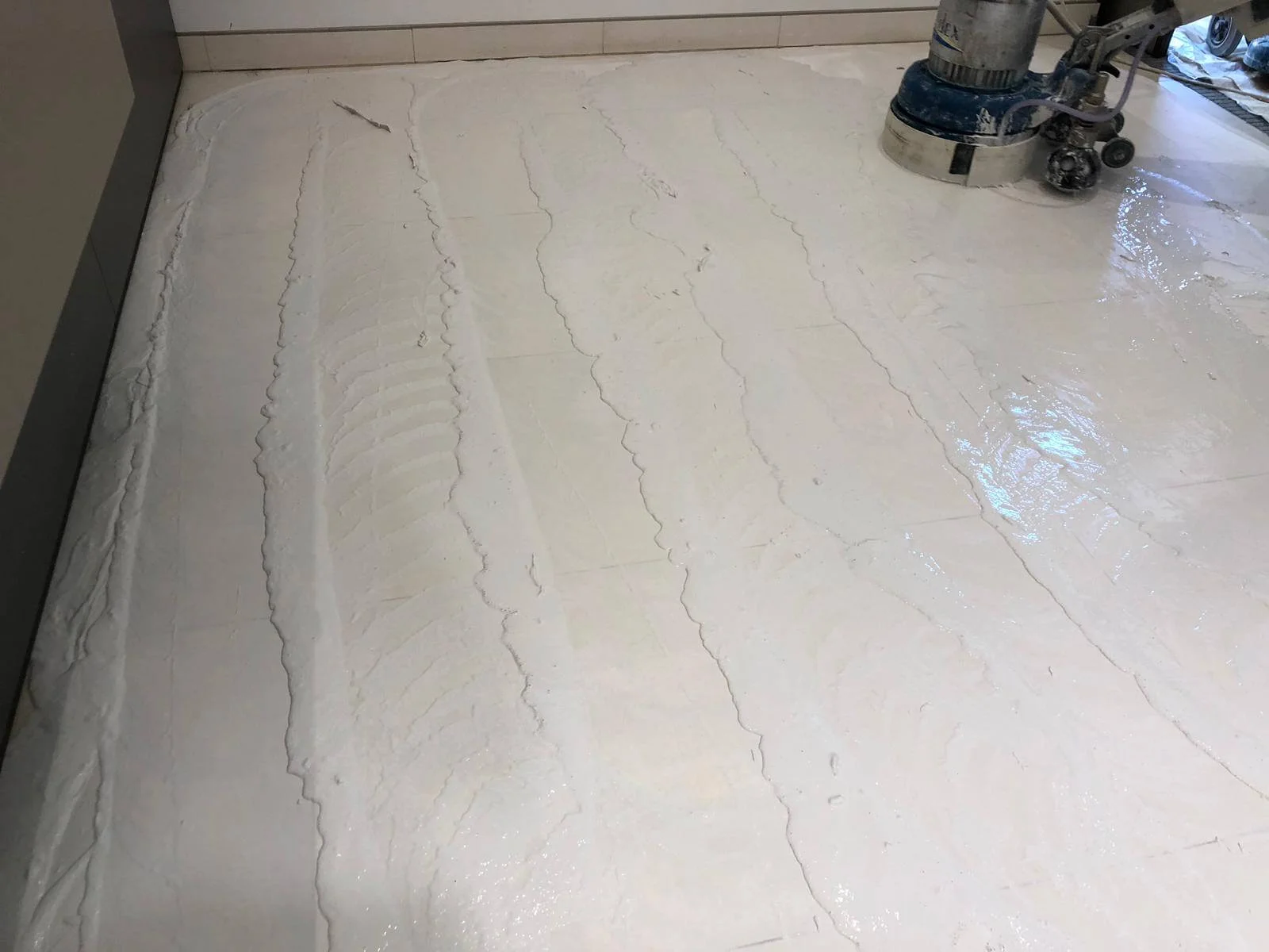 Limestone floor polishing in progress at Regents Street Medical Centre, London.