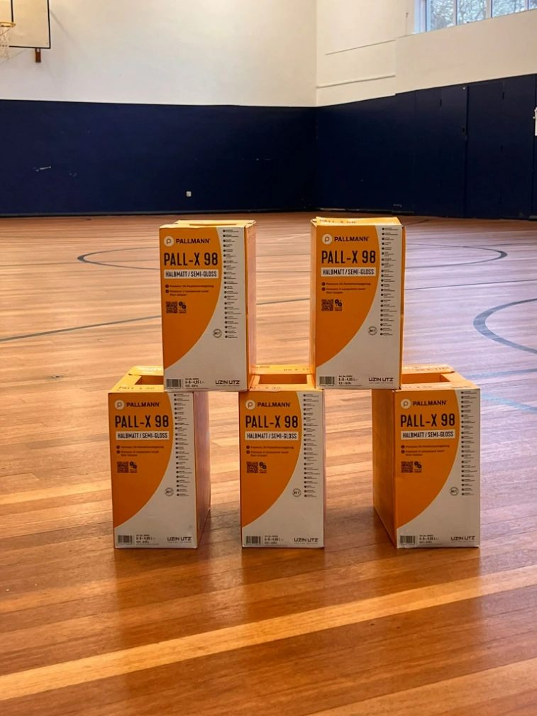 Pallmann Pall-X 98 boxes displayed on a newly sanded school sports hall floor in Croydon.