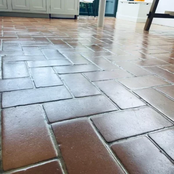 Terracotta floor cleaning and sealing with a gloss finish in London. Finishe terracotta floor restoration