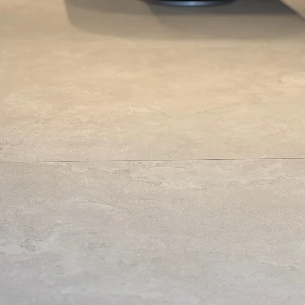 Close-up of textured porcelain floor showing detailed surface finish