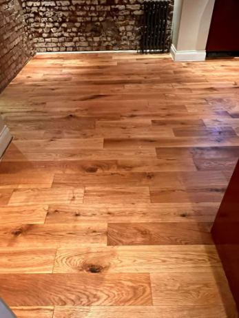 Restored oak floor in Highbury after professional sanding and oiling by Silver Lining Floor Care, highlighting a rich grain and warm tones.