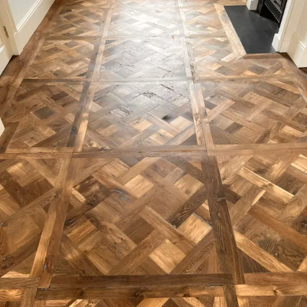 Elegant parquet wood floor in a London home, maintained with expert care and routine guidance from floor care professionals.