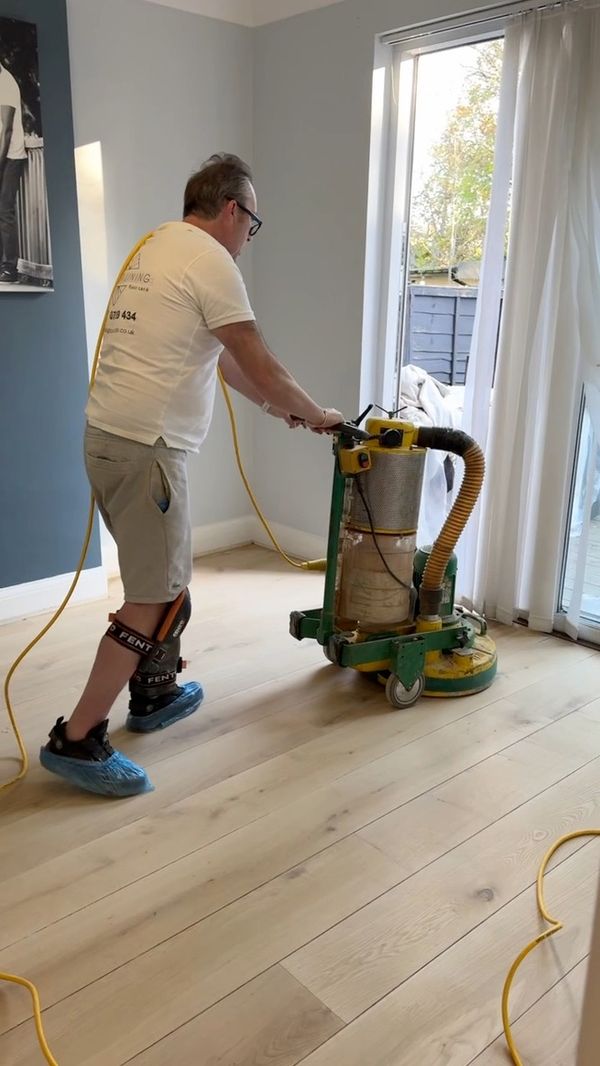 Dust-controlled wood floor sanding in a London home