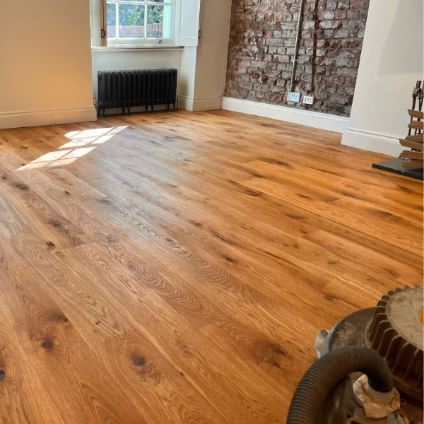Expertly oiled wooden floor with a smooth, even finish, highlighting professional sanding and application techniques.