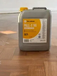 Pall-X 96 container on a restored teak herringbone floor during sanding and finishing in Berkhamsted